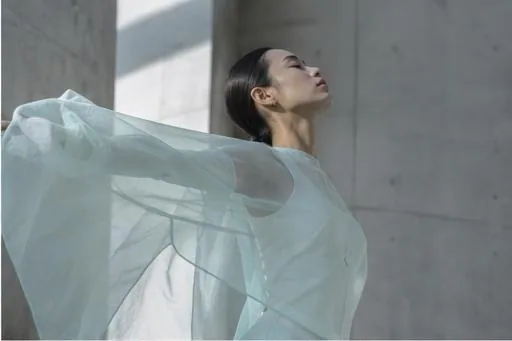 A dancer turning, fabric caught in motion